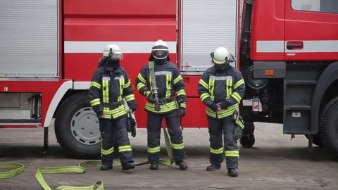 Three firefighter gear to go on camera Stock Footage 73240579