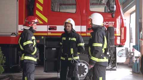 Three firefighter gear standing at the Stock Video Pond5