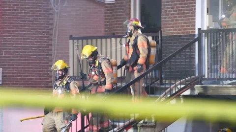 Three firefighters on-scene of structure fire scene Stock Footage 114742423