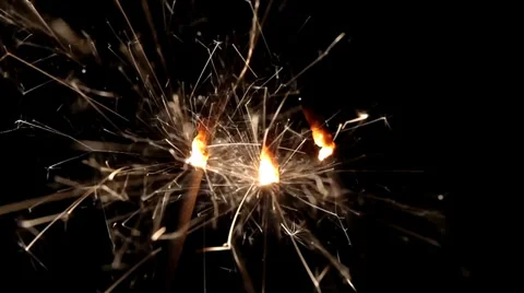 Three firework sparklers burning Stock Footage 36437785