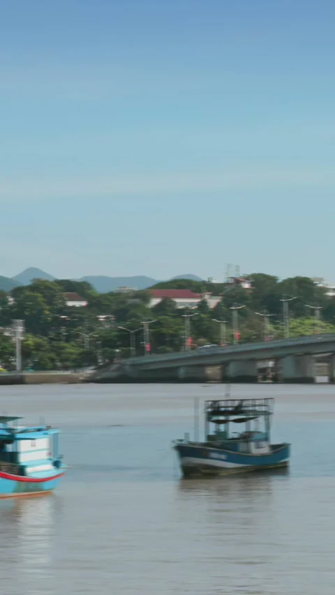Three fishing boats float on the Cai River in Nha Trang, Vietnam. Stock Footage 333937439