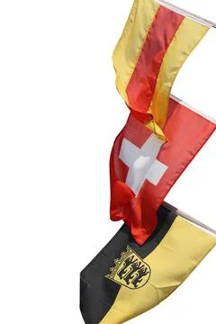 Three flags on the flagpoles - waving in the wind. Flags of Baden, Switzerl.. Foto stock