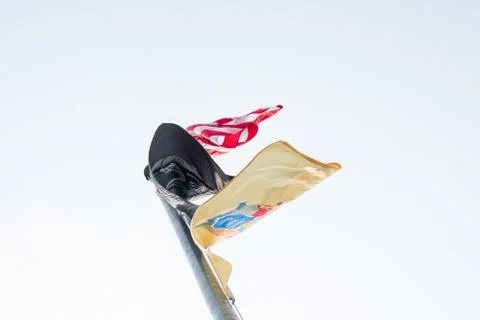 Three Flags Flying in a Grey Sky, One Being a United States Flag Stock Photos