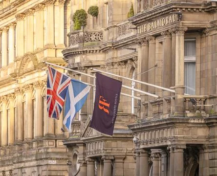 Three flags flying outside The Balmoral, a Grandiose and Luxury Five Star Hotel  Stock Photos