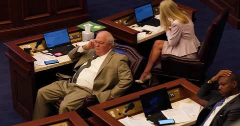 Three Florida State Senators seated, listening to floor debate, 2019 session Stock Footage 107572460