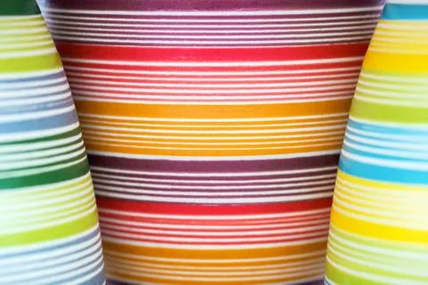 Three Flower Pots in Bright Colored Stripes Stock Photos