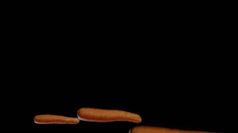 Three flying carrots getting split mid flight Stock Footage 165216425