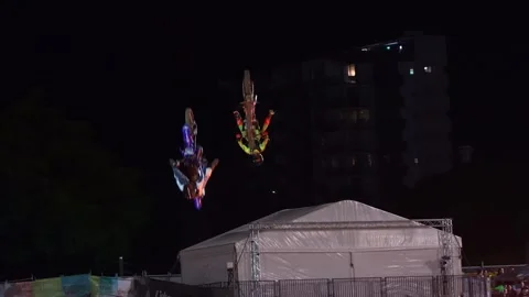 Three freestyle motocross riders performing jumps, adrenaline-pumping stunts Stock Footage 313633510