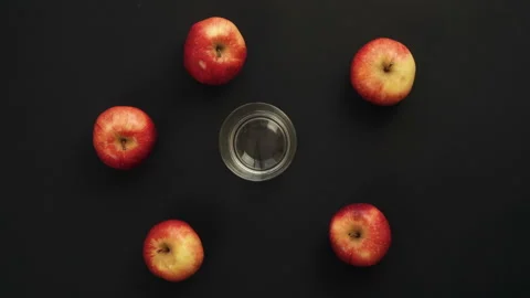 Three fresh apples is Squeezed Into a Glass. Stop Motion Animation Stock Footage 87827919