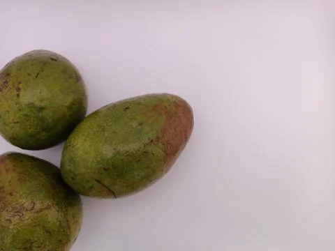 Three fresh avocado in a white background Stock Photos