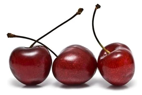 Three fresh cherries. Stock Photos