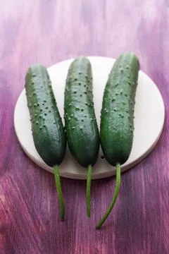 Three fresh cucumbers Stock Photos