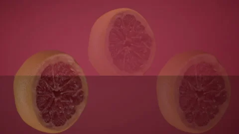 Three Fresh Grapefruit Slices Tossed Up Flying Hanging In The Air And Falling Stock-Footage 137316143