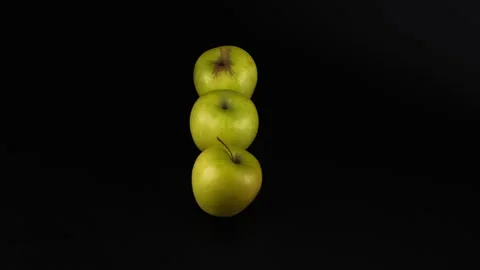 Three fresh green apples on a black background Stock Footage 331661583