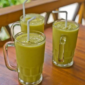 Three fresh mango milkshakes Stock Photos