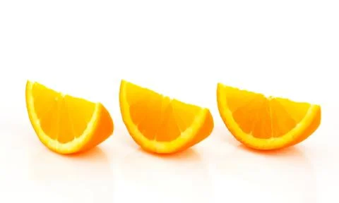 Three fresh orange slices on plain background Stock Photos