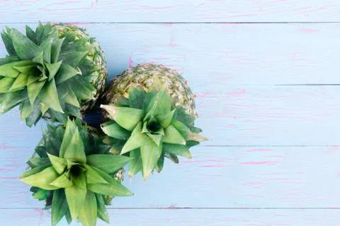 Three fresh pineapples viewed from the top Stock Photos