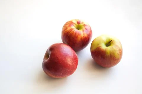 Three fresh red apples Stock Photos