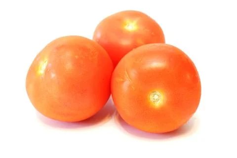 Three fresh red tomatoes close up on white background isolated Foto stock