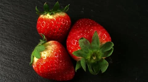 Three fresh strawberries Stock Footage 21939264