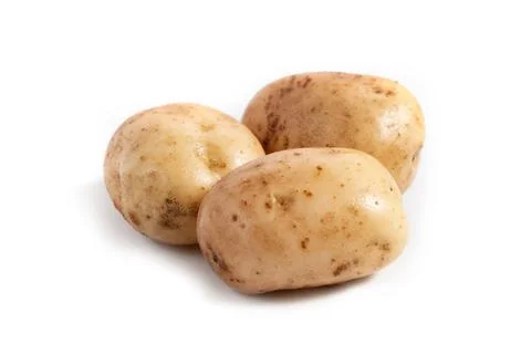 Three fresh white potatoes on a white background Stock Photos