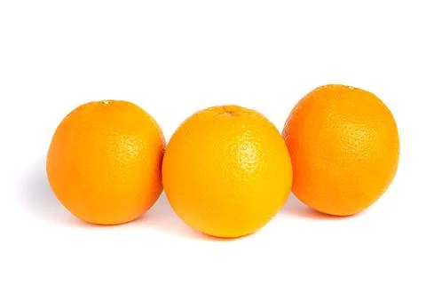 Three Fresh Whole Oranges in a Row 写真素材