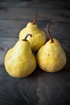 Three fresh yellow pears Stock Photos