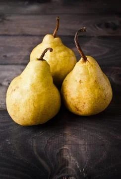 Three fresh yellow pears Stock Photos