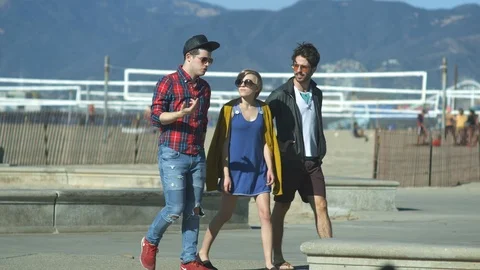 Three friends at the beach Stock Footage 86537268