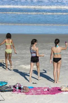 Three friends at the beach Stock Photos