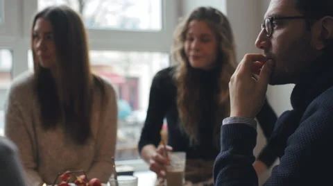 Three Friends Conversing in Bright Café Stock Footage 59785125