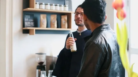 Three Friends Conversing in Bright Café Video stock 59785260