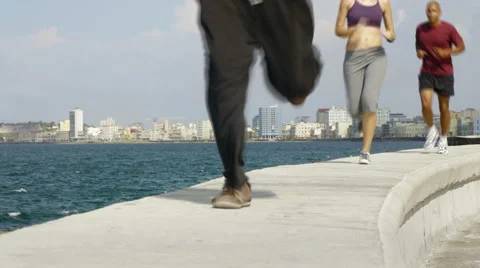 Three friends doing sport activities near the sea in Havana, Cuba Stock Footage 4884425