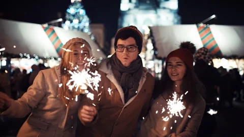 Three Friends Funny Dancing in the middle of the street in the lights of a Stock Footage 220633355