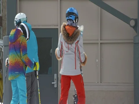 Three friends getting ready to ski Stock Footage 84503200