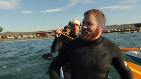 Three friends have fun canoeing on the ocean. 스톡 동영상 88405775