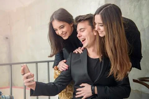 Three friends having fun in a cafe Stock Photos