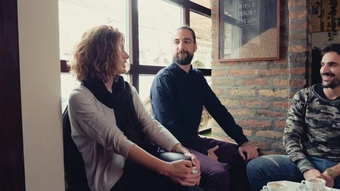 Three friends having fun while talking in cafeteria Stock Footage 95907171