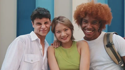 Three friends looking at the camera with smile Stock Footage 254915242