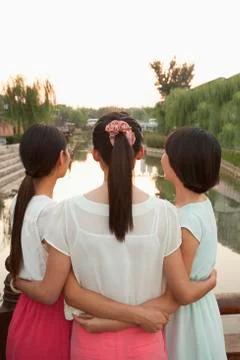 Three Friends Looking at River Stock Photos
