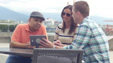 Three friends looking at tablet Stock Footage 67353518