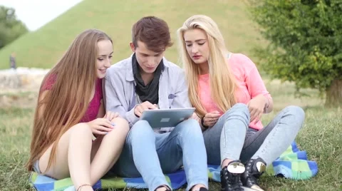 Three friends playing game on tablet pc. They winning again. Stock Footage 55233157