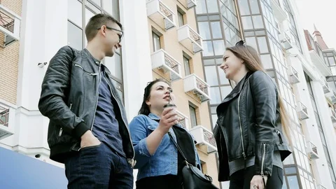 Three friends talking on a coffee break during the break, laughing Stock Footage 113855190