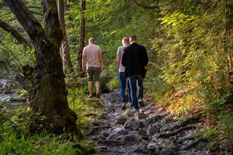 Three friends talking a walk through beautiful nature around river Gradac Fotos Stock