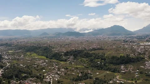 Three friends at the top of the mountain talking while appreciating the scenery Stock Footage 140696845