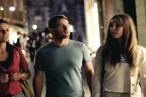 Three friends walking in the old town in the evening Stock-Footage 12318089