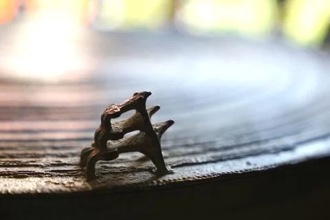 Three frogs on surface of ancient bronze drum. Frog drum or Rain drum in Thai Stock Photos