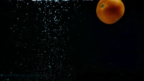 Three fruits slow motion dropping in to the water and splashing in back b Stock Footage 159613162