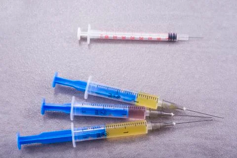 Three full injections ready to make shot on table Stock Photos