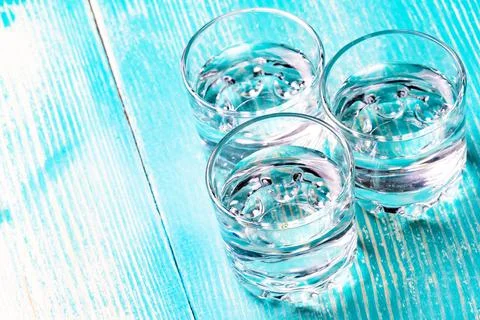 Three full stacks of vodka on the table Stock Photos